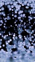An Abstract Blue and Black Bokeh Background that features a Soft Focus Effect for Aesthetics. Design video