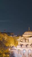 Beautiful mosque on background of night city. Action. Illuminated by lanterns, mosque on background of Istanbul in evening. Top view of evening Istanbul with illuminated mosques video