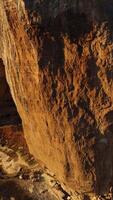 Aerial view of a giant cliff at sunset on a summer sunny day. Shot. Massive but not deep arcuate cave inside rock formation, beautiful nature. video