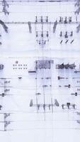 Electric station poles in winter. Action. Top view of modern electrical substation with rows of transformers in winter. Rows of electric poles at station video