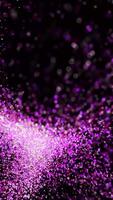 Dust moves around ball. Animation. Colorful dust is blown up in form of balls. Magnetized dust moves in streams on black background video