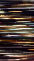 Abstract energy pillar from golden and white shining rays on black background, seamless loop. Animation. Moving slowly beautiful lines. video