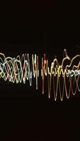 Abstract beautiful spinning bended golden and white lines isolated on black background, seamless loop. Animation. Rotating waving spiral shape. video