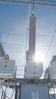 High-voltage power equipment. Action. Latest transformers at substations for production of high electricity. Electric substation with transformers on background of sunny sky video