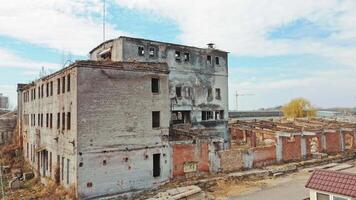 Abandoned building. Aerial view of an old factory ruin and broken windows. video
