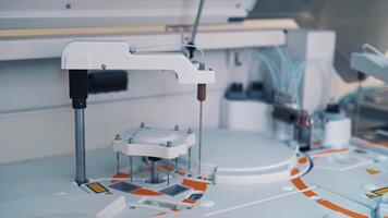 Functional medical laboratory with biochemical analyzer in it. Working process of automated machine in a laboratory. Chemical and biological laboratory of examining blood. video