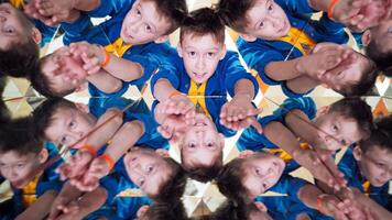Many small triangles in kaleidoscope and curious boy in each one. Multicoloured pictures of a child in a kaleidoscope tunnel. video