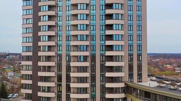 Multy-storey building with new design for high structure in the city. Aerial view of a beautiful high-rise public housing apartments. Camera moves right. video