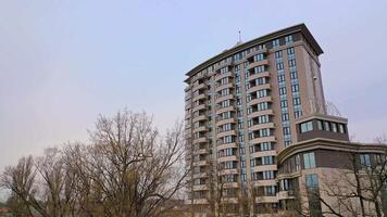 Newly built modern multy-storey building in the urban district. New design for high structure. Camera motion bottom up video