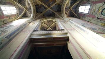Interior of the old cathedral of the Assumption of the Blessed Virgin Mary. Beautiful view of religious building inside. Camera moves upside down. video