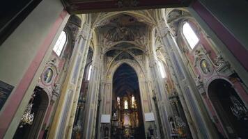 Interior of the beautiful cathedral with long columns. Cathedral of the Assumption of the Blessed Virgin Mary. Camera moves to the ceiling. video