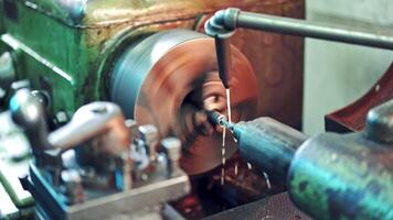 Process of cutting metal in turning lathe on the industrial factory background. Metalworking details and parts on lathe at industrial factory in manufacturing background video