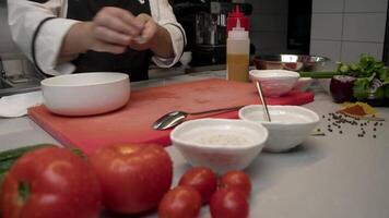 Chef places the finely diced raw beef into a dish and then adds a generous portion of a delightful honey mustard dressing. Slow motion video