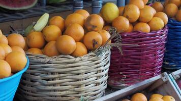 Vibrant Fresh Oranges Are Beautifully Showcased in Colorful Baskets at the Local Farmers Market video
