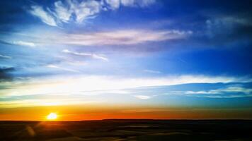Aerial view of the countryside with the rising sun and oil painting effect photo