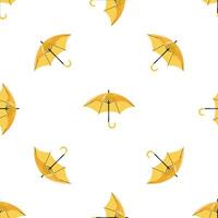 Seamless pattern with open yellow umbrellas protecting from rain on white background vector