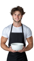 Smiling young male chef in apron holding a bowl, isolated on transparent background png