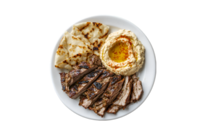 Grilled beef with pita and hummus on a plate isolated on a transparent background png