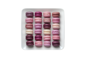 Colorful macarons arranged on a rectangular plate isolated on a transparent background png