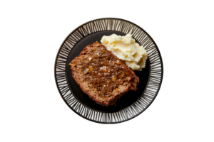Meatloaf with mashed potatoes on a plate isolated on a transparent background png