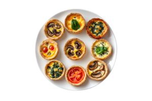 Assorted mini quiches on a plate isolated on a transparent background png
