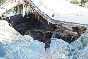 VALENCIA, SPAIN OCTOBER 31, 2024. Destroyed car interior filled with mud, debris, and broken glass after a severe flood in Valencia photo