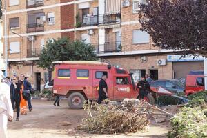 VALENCIA, SPAIN OCTOBER 31, 2024. Military emergencies unit - ume - and rescue workers operating in a flooded street of Valencia after heavy rains photo