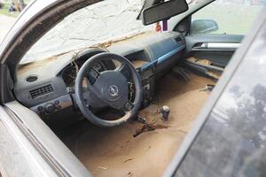 VALENCIA, SPAIN OCTOBER 31, 2024. Mud filled interior of a car showing the devastating aftermath of flooding in Valencia photo