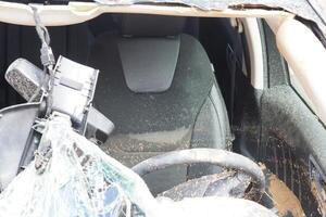 VALENCIA, SPAIN OCTOBER 31, 2024. Devastating consequences of flooding, mud and debris inside damaged car in Valencia photo