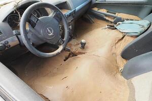 VALENCIA, SPAIN OCTOBER 31, 2024. Muddy car interior showing the devastating effects of flooding in Valencia, Spain photo