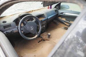 VALENCIA, SPAIN OCTOBER 31, 2024. Mud filled car interior showing the devastating aftermath of flooding in Valencia photo