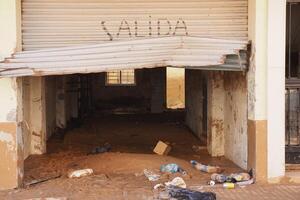 VALENCIA, SPAIN OCTOBER 31, 2024. Mud and debris cover the floor of a ruined shop in Valencia, Spain, after severe flooding, highlighting the devastating impact of the natural disaster photo