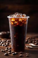 cold coffee in a transparent plastic cup, presented on an old wooden table with scattered coffee beans and vintage kitchen utensils photo