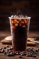 cold coffee in a transparent plastic cup, presented on an old wooden table with scattered coffee beans and vintage kitchen utensils photo