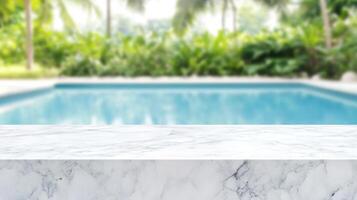 white marble top with blurred empty Swimming pool background can be used for mocking up or display product to make advertising photo