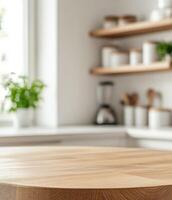 Beautiful round wood tabletop counter inside, empty, with a bright, clean kitchen background. Ideal for banners and product montage displays. photo