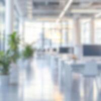Blurred background of modern workplace with lots of greenery and natural light. Interior shots of offices photo