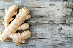 A high-resolution image of a fresh ginger root on a rustic wooden background, perfect for product placement and text overlay photo