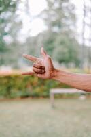 hand fingers displaying various symbols and number or gestures photo