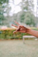 hand fingers displaying various symbols and number or gestures photo