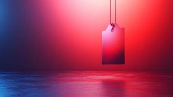 A red and blue price tag hanging from a string photo