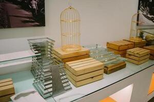 Wooden food display table with multiple boards arranged to hold various treats like cookies and pastries photo