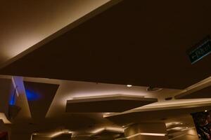 Elegant and luxurious hotel ceiling with intricate design and soft lighting, photo