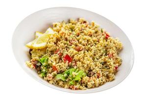 tabbouleh bulgur couscous with vegetables dish fresh delicious vegetarian and vegan food gourmet food background on the table rustic food top view copy space keto and paleo diet photo
