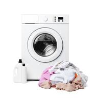 White Washing Machine With Open Door and Clothes Overflowing From a Wicker Basket photo