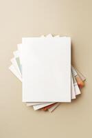 Stack of blank paper on beige background photo
