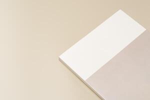 Stack of blank paper on beige background photo