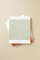 Stack of blank paper on beige background photo