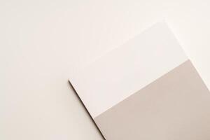 Stack of blank paper on beige background photo