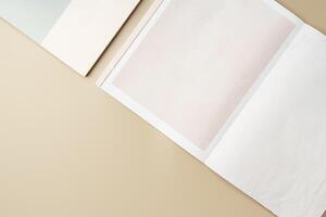 Stack of blank paper on beige background photo